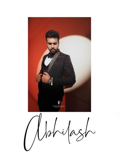A portrait of the groom, Abhilash, looking dapper in his reception suit.