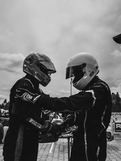 A black and white shot symbolizing sportsmanship between two drivers.