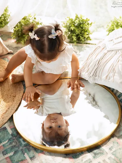 A moment of self-discovery in the great outdoors. Using a mirror as a prop in a nature setting can create truly unique and reflective portraits.
