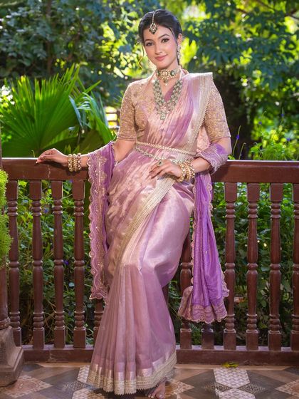 The elegance of this look is in its balance. The intricate gold blouse and emerald jewelry are the heroes, supported by soft, luminous makeup.