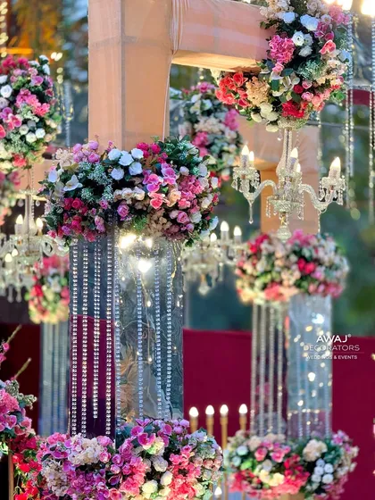 A close-up of the hanging floral arrangements and crystal chandeliers, showcasing the intricate and luxurious details.
