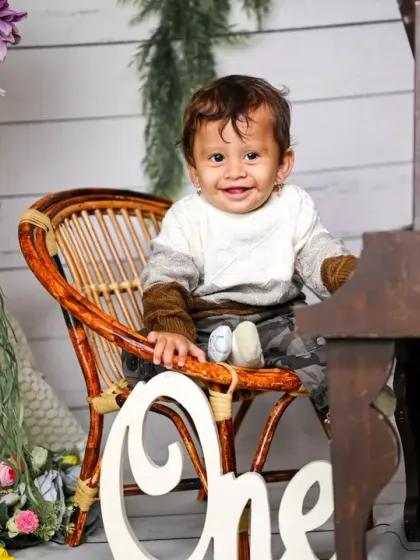 A duplicate of image 21, a classic and elegant first birthday photo.