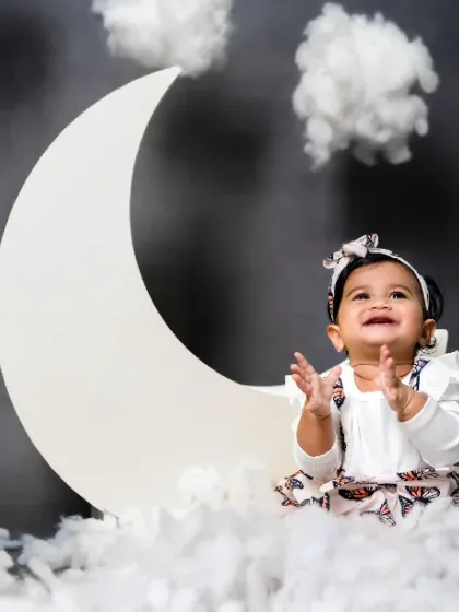 Soft as moonbeams, bright as the stars. The joy on her face makes this photo truly special.