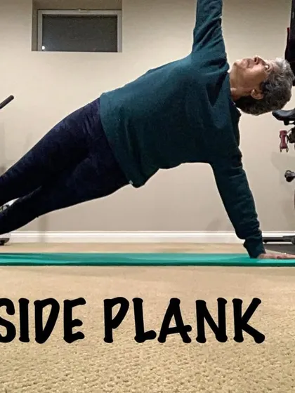 A side plank in my home gym. This pose is a staple in my classes for building lateral core strength.