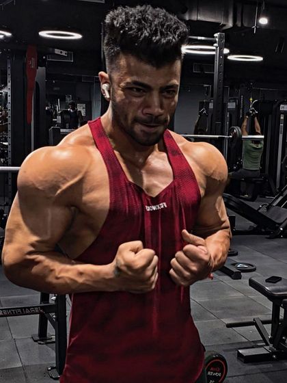 A flex shot in the gym. This is the result of following my own protocol for building shoulder and arm size.