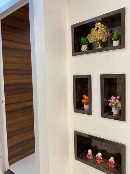 A close-up of the built-in wall niches, perfect for displaying small plants and decorative items. This is a simple way to add personality and storage to a passageway.
