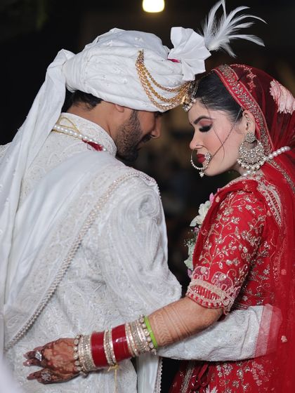 An intimate moment between the bride and groom. The makeup is designed to be timeless and elegant.