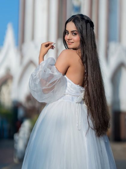 A happy and confident pose. The makeup is natural and fresh, perfect for this theme.