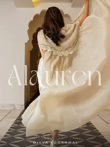 A dramatic shot of Chitrangda Singh, capturing the ethereal movement and flow of our Alauren Cape Set.