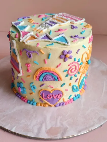This side of Theo's cake features a rainbow and a heart filled with the word "Love". We can incorporate any theme or design you have in mind.