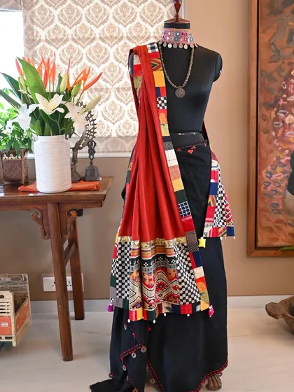 A bespoke wrap that marries the weaving traditions of two distinct cultures. This piece combines a vintage 'Tin Sinh' tribal silk from Laos, featuring a Naga serpent motif, with the earthy texture of hand-woven Kala cotton from Kutch, Gujarat.