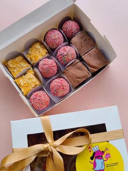 A closer look at 'Simba's Mithai Box' for Diwali. It's packed with delicious laddoos, brownie barfis, and pumpkin coconut barfis, all beautifully arranged and ready to be gifted.
