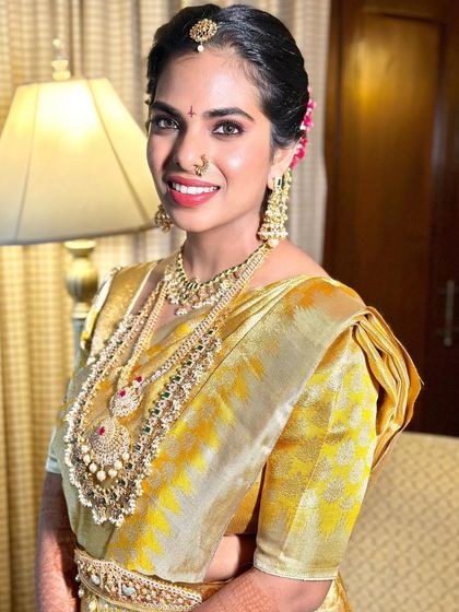 The bride's portrait, capturing her elegance and the traditional beauty of a South Indian wedding look.