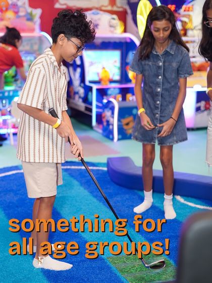 Something for all age groups. Here, older kids enjoy a round of mini-golf, showcasing how our activities are designed to entertain everyone, not just the little ones.
