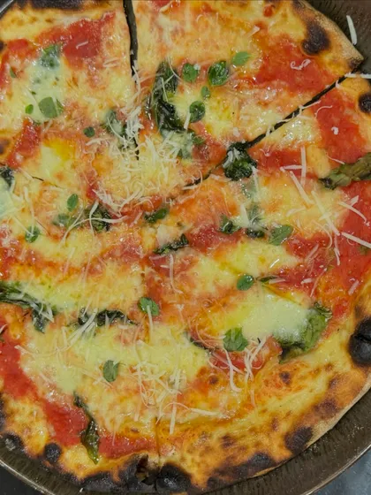 Introducing the Tonda Romana, a different style of pizza with a thinner, crispier crust. It's incredibly light and packed with flavor.