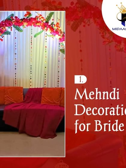 This is a classic and comfortable seating arrangement for the bride during her Mehndi ceremony. A sofa with bright cushions is placed under a beautiful arch of pink flowers and hanging crystal strings, creating a rich and elegant look.