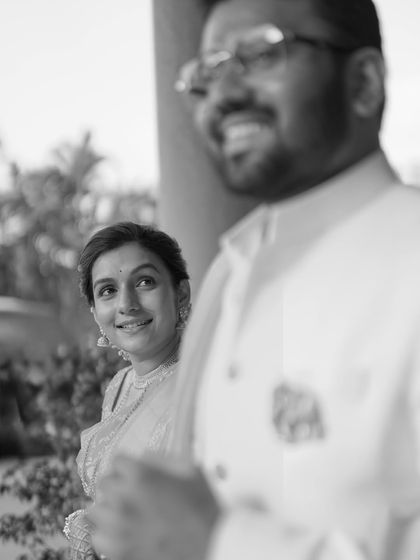 A beautiful black and white shot of the bride looking at her groom with adoration. The focus on her expression tells a powerful story of love.