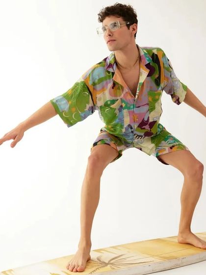 A playful shot for Tizzi's menswear resort collection, with the model posed on a surfboard prop in our studio.