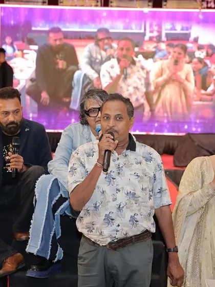 Sharing the mic with a family member on stage. It's moments like these, where guests become part of the show, that are truly memorable.