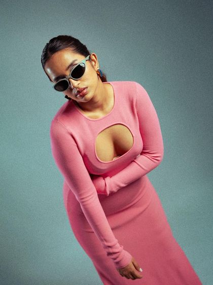 A stylish portrait featuring modern sunglasses. The angle and pose give off a cool, detached vibe, perfect for a high-fashion editorial or a contemporary brand.