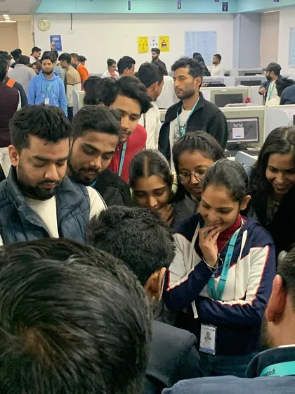 A moment of pure focus as employees gather around during an office entertainment session. My close-up magic is designed to be highly engaging, pulling people away from their desks for a shared moment of wonder.