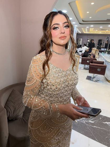 What a beauty. This client is wearing a stunning golden gown, and we gave her a celebrity-inspired silicon glam makeup look to match.