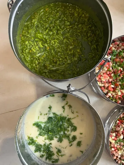 Large pots of Palak Khichdi and Kadhi, perfect for a large family meal.