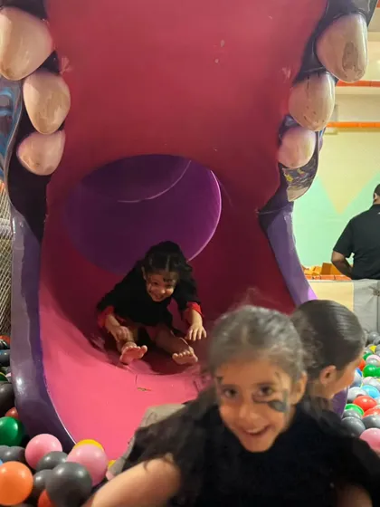 Whee! The play zone is open during all my events, so kids can slide, jump, and burn off all that party energy. These happy faces coming down the hippo slide say it all.
