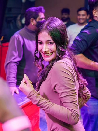 A smiling guest enjoying the music.