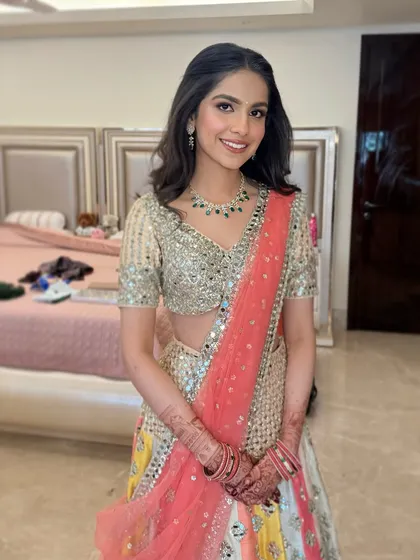Pink perfection. Manvi looks absolutely stunning for her Roka ceremony. Soft hues of pink, a radiant glow, and a touch of shimmer make for the perfect dainty and fresh look.