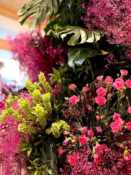 The soft texture of pink carnations and baby's breath contrasts beautifully with the bold, architectural shapes of the monstera leaves. It is this balance of delicate and strong that brings my arrangements to life.