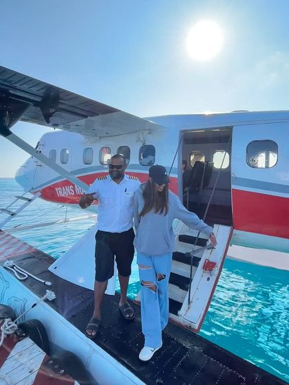 Disembarking from the seaplane onto the crystal clear waters of the Maldives.