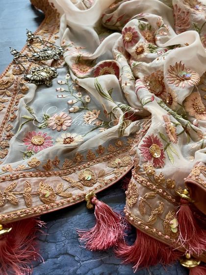 A detail shot of the dupatta's border, with its Doriwork and sequin highlights.