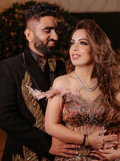 A beautiful couple shot from the engagement. Her makeup looks flawless and complements her groom's sharp look.