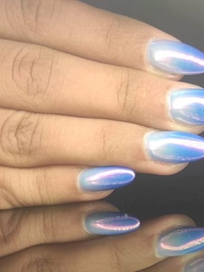 A close-up of the magical blue and pink iridescent chrome nails.