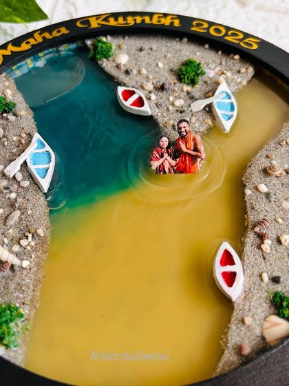 The details of the Triveni Sangam art are what make it so special. Here you can see the texture of the sand, the tiny boats, and the clear distinction between the two river colors.