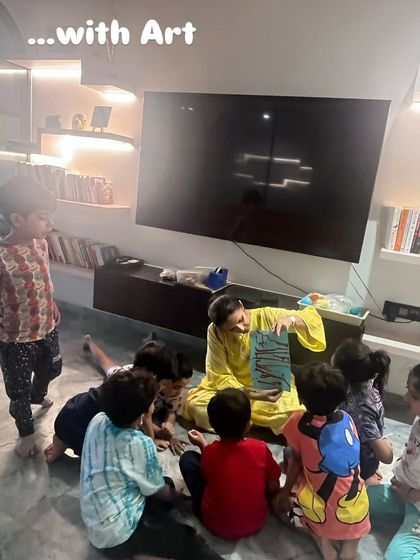 Here I am, using a storybook to introduce the concept of gravity. Blending art and storytelling with science makes the learning process more engaging and memorable for young minds.