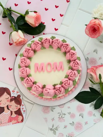 My classic "MOM" cake, beautifully styled with fresh roses and a cute mother-daughter card.