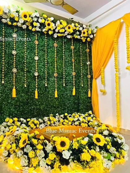 The full grand Haldi setup with integrated lighting, showing how the decor glows and comes to life in the evening.
