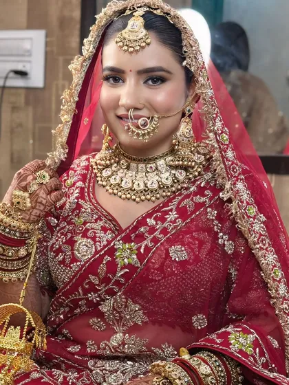 This bride looks absolutely radiant. The makeup enhances her natural beauty, giving her a confident and happy glow.
