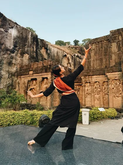 A still from my performance at the Ellora caves. This pose captures a moment of storytelling through Abhinaya, set against the backdrop of ancient rock-cut architecture.