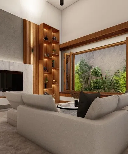 A full view of a contemporary living room, showcasing the L-shaped sofa, the textured accent wall behind the TV, and the large window that offers a view of the garden.