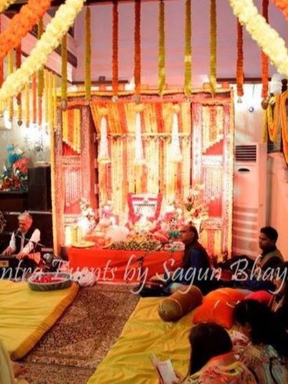 I provide decoration services for home-based religious ceremonies and pujas. This setup uses traditional marigold strings and drapes to create a sacred and festive atmosphere.