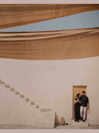A minimalist and architectural shot from a destination pre-wedding shoot in Dubai, using the clean lines and shadows of the building.