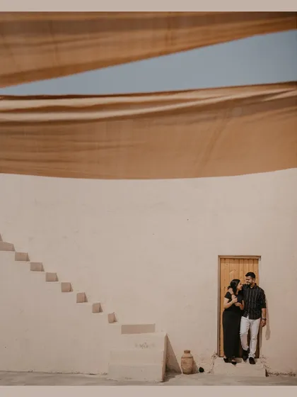 A minimalist and architectural shot from a destination pre-wedding shoot in Dubai, using the clean lines and shadows of the building.