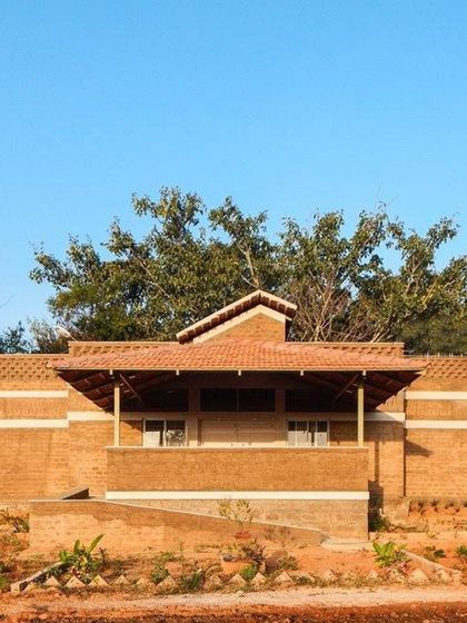 Emphasis is created here by the building's form, which stands out against the natural landscape.