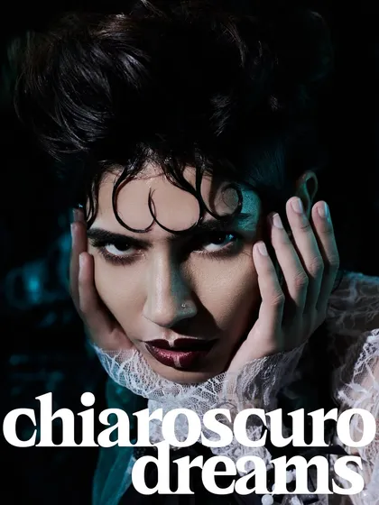 'Chiaroscuro Dreams'. This close-up uses the classic art technique of strong light and shadow to create a dramatic, intimate beauty shot.