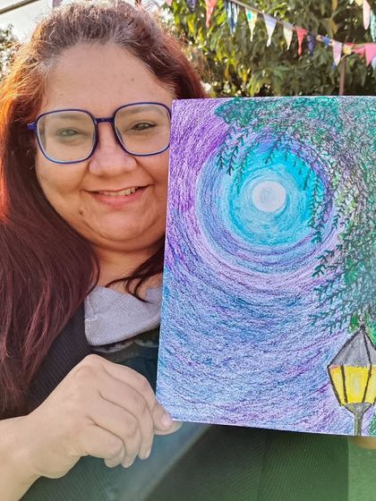 It's never too late to learn something new. Here's my newest adult student proudly showing her beautiful oil pastel artwork after our one-on-one session.