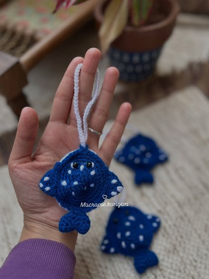 A whimsical stingray-themed pouch, perfect for ocean lovers. The design is unique and playful, making it a fun accessory or gift.