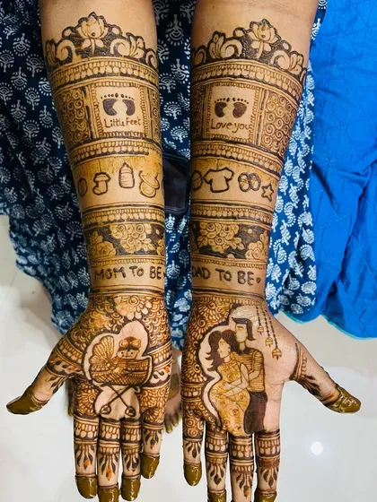 I love creating designs that tell your unique story. This intricate baby shower mehendi includes a couple portrait, a baby in a pram, tiny footprints, and other cute symbols like onesies and milk bottles to celebrate your journey.